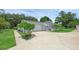 Home exterior featuring a single-car garage, landscaping and driveway at 103 Longhorn Rd, Winter Park, FL 32792