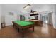 Entertainment room featuring a pool table and poker table with natural light at 103 Longhorn Rd, Winter Park, FL 32792