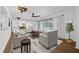 Cozy living room with view of the pool, stylish furniture, and bright lighting at 103 Longhorn Rd, Winter Park, FL 32792