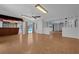 Spacious living room featuring bright natural light, ceiling fan and a view of another living space at 103 Longhorn Rd, Winter Park, FL 32792