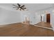 Living room with hardwood floors, neutral paint, ceiling fan, and open access to the rest of the home at 103 Longhorn Rd, Winter Park, FL 32792