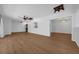 Bright living room with wood floors and adjacent rooms with fireplace at 103 Longhorn Rd, Winter Park, FL 32792