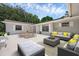 Outdoor patio area featuring comfortable seating, a dining table, and a stylish design, perfect for entertaining at 103 Longhorn Rd, Winter Park, FL 32792