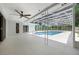 Enclosed pool area with a ceiling fan and sliding glass doors for easy access to the rest of the house at 103 Longhorn Rd, Winter Park, FL 32792