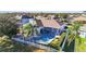 Aerial view of home showcasing private pool, patio, and beautifully landscaped backyard at 10642 Cloudview Dr, Orlando, FL 32825