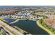 Panoramic aerial view of a lakeside community featuring mature trees and beautiful homes at 10642 Cloudview Dr, Orlando, FL 32825