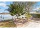Charming backyard patio with stone pavers, perfect for outdoor dining overlooking the lake at 10642 Cloudview Dr, Orlando, FL 32825