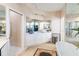 Bright bathroom with double sinks, vanity, soaking tub and decorative rug at 10642 Cloudview Dr, Orlando, FL 32825