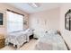 Cozy bedroom featuring two twin beds with matching linens and a dresser at 10642 Cloudview Dr, Orlando, FL 32825