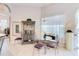 Charming dining room with large window, decorative cabinet, and seating for four at 10642 Cloudview Dr, Orlando, FL 32825