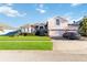 Lovely home featuring an attached garage, lush lawn, and stone facade details at 10642 Cloudview Dr, Orlando, FL 32825