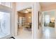 Inviting hallway with views into a home office and a bedroom at 10642 Cloudview Dr, Orlando, FL 32825
