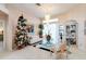 Bright living area featuring a Christmas tree, elegant decor, and a chandelier at 10642 Cloudview Dr, Orlando, FL 32825