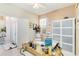 Comfortable office space with natural light, stylish desk, and ample storage at 10642 Cloudview Dr, Orlando, FL 32825