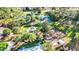 A neighborhood playground featuring new playground equipment for outdoor activities surrounded by palm trees at 10642 Cloudview Dr, Orlando, FL 32825