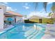 Backyard pool and spa area, pool furniture, and privacy hedges at 10642 Cloudview Dr, Orlando, FL 32825