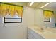 Neutral bathroom featuring a white vanity and custom window treatments at 112 Brandywine Ln, Longwood, FL 32779