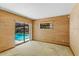 Bedroom with wallpaper, windows and a sliding glass door with pool views at 112 Brandywine Ln, Longwood, FL 32779