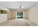 Bright bedroom with neutral carpet, slider to pool area, and floral valance at 112 Brandywine Ln, Longwood, FL 32779