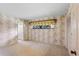 Bedroom featuring dated wallpaper and an attached bathroom at 112 Brandywine Ln, Longwood, FL 32779