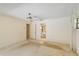 View of the bedroom featuring a ceiling fan and a doorway to an adjoining bathroom at 112 Brandywine Ln, Longwood, FL 32779