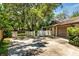 Driveway leading up to a house with a garage and fenced in yard at 112 Brandywine Ln, Longwood, FL 32779