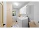 Practical laundry room with washer, dryer, overhead cabinets, and a utility sink at 112 Brandywine Ln, Longwood, FL 32779