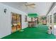 Covered patio area featuring a ceiling fan, bar, and access to the outdoors at 112 Brandywine Ln, Longwood, FL 32779