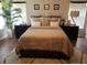 Cozy bedroom featuring neutral tones, wood floors, and stylish furnishings at 1122 Priory Cir, Winter Garden, FL 34787
