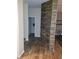 Entryway with stone accent wall and hardwood floors at 1122 Priory Cir, Winter Garden, FL 34787