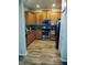 Kitchen with stainless steel appliances, wood cabinets, and tile backsplash at 1122 Priory Cir, Winter Garden, FL 34787