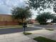 Street view with crosswalk, landscaping, and surrounding buildings at 1122 Priory Cir, Winter Garden, FL 34787