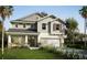 Charming two-story home featuring a covered porch, attached two-car garage, and well-maintained landscaping at 13518 Maria Lavin Circle Rd, Orlando, FL 32828