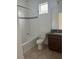 Bright bathroom features a shower/tub combo and granite countertops at 14741 Milfoil Ave, Orlando, FL 32827