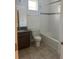 Bright bathroom features a shower/tub combo and granite countertops at 14741 Milfoil Ave, Orlando, FL 32827