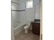 Bright bathroom features a shower/tub combo and granite countertops at 14741 Milfoil Ave, Orlando, FL 32827