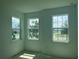 This bedroom has bright, natural light coming in from three windows at 14741 Milfoil Ave, Orlando, FL 32827