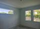 Bedroom featuring large windows and natural light at 14741 Milfoil Ave, Orlando, FL 32827