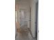 Hallway with white doors, trim and neutral colored flooring at 14741 Milfoil Ave, Orlando, FL 32827