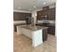 Spacious kitchen island with granite countertops and stainless steel appliances at 14741 Milfoil Ave, Orlando, FL 32827