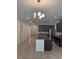 Open kitchen featuring granite countertops, stainless steel appliances, and tile flooring at 14741 Milfoil Ave, Orlando, FL 32827