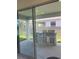 Outdoor kitchen and patio with built-in grill at 14741 Milfoil Ave, Orlando, FL 32827
