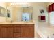 Elegant bathroom with double vanity, soaking tub, and neutral decor at 14741 Sapodilla Dr, Orlando, FL 32828