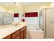 Relaxing bathroom with a large soaking tub and separate shower at 14741 Sapodilla Dr, Orlando, FL 32828