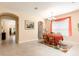 Well-lit dining room showcasing tile flooring, arched doorways, and traditional decor at 14741 Sapodilla Dr, Orlando, FL 32828