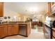 Spacious kitchen with stainless steel appliances, granite countertops, and an adjoining dining area at 14741 Sapodilla Dr, Orlando, FL 32828