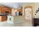 Open kitchen featuring wood cabinetry, granite countertops, and modern stainless steel appliances at 14741 Sapodilla Dr, Orlando, FL 32828