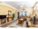 Open living room with tile floors, area rug, and plenty of room for entertaining guests at 14741 Sapodilla Dr, Orlando, FL 32828