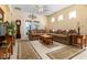 Bright living room featuring a large sectional sofa, area rugs, and neutral color scheme at 14741 Sapodilla Dr, Orlando, FL 32828