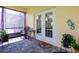 Cozy screened-in patio with stone flooring, french doors, and plants at 14741 Sapodilla Dr, Orlando, FL 32828